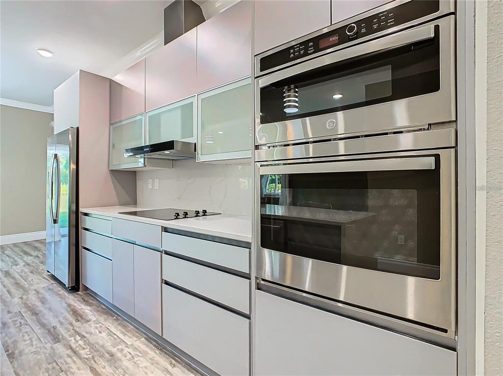 2000 Greenbriar Terrace Davenport, FL 33837 - Photo 10 of 50 a kitchen with granite countertop cabinets and steel stainless steel appliances