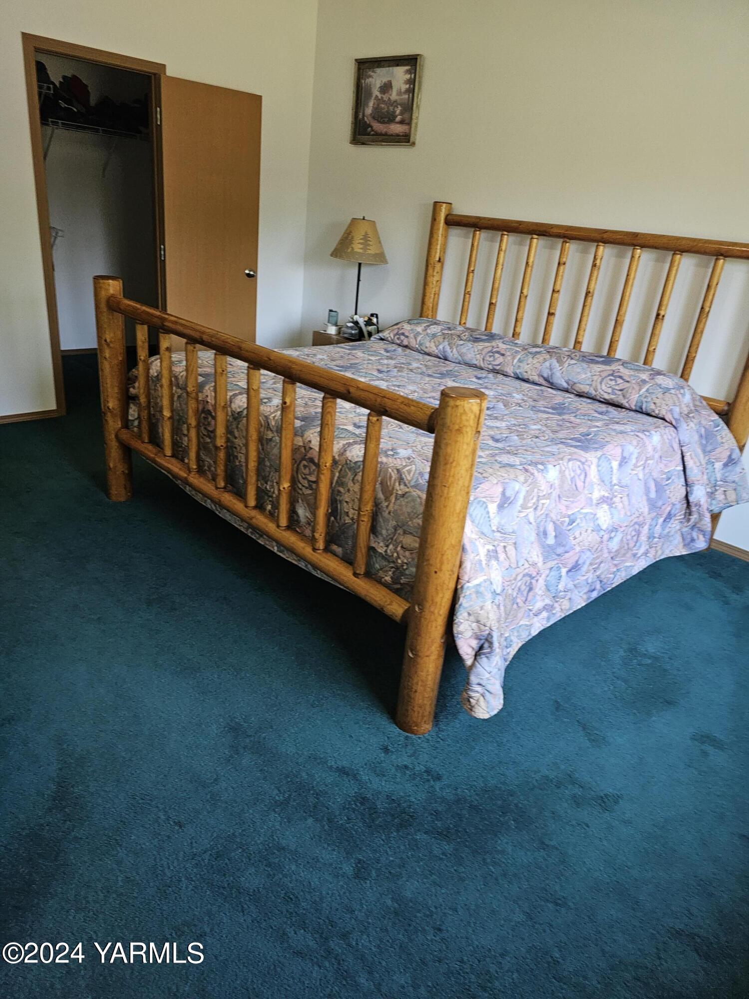 12933 Missimer Road Prosser, WA 99350 - Photo 9 of 39 a view of a bedroom with furniture and wooden floor