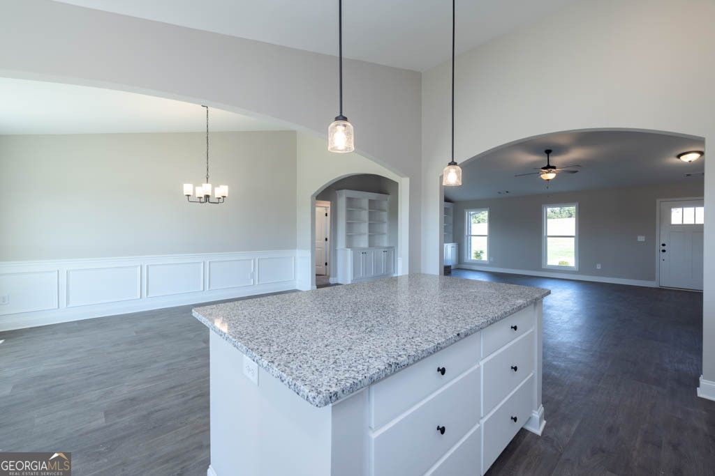 1247 Anderson Thomas Road, Unit 9 Martin, GA 30557 - Photo 12 of 30 a view of a kitchen island a chandelier and wooden floor