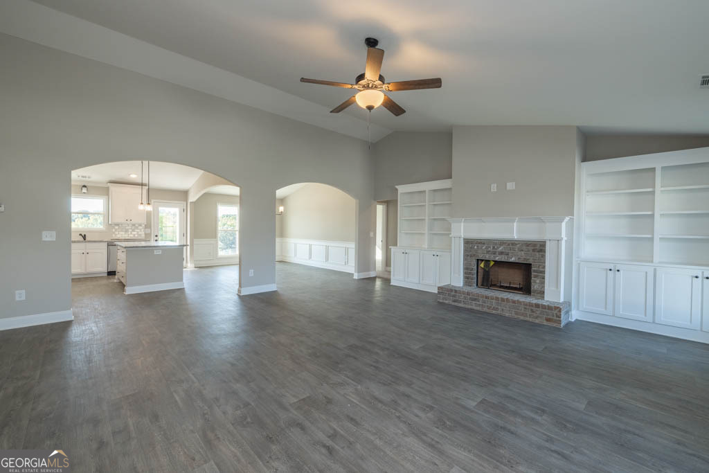 1247 Anderson Thomas Road, Unit 9 Martin, GA 30557 - Photo 3 of 30 a view of a livingroom with a fireplace wooden floor and fire place