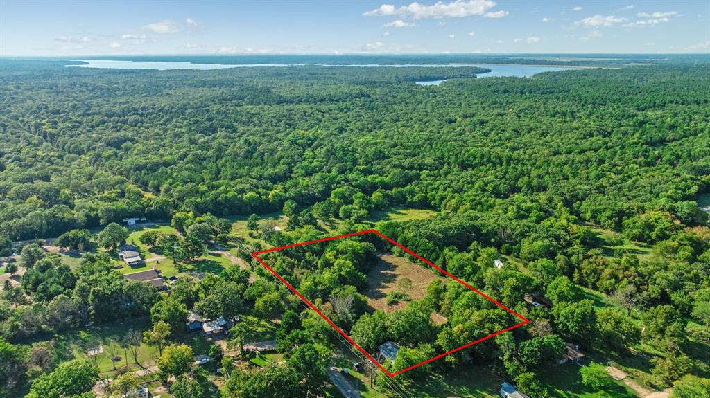 104 County Road Powderly, TX 75473 - Photo 1 of 1 View of property location featuring a large body of water and property parcel outlined