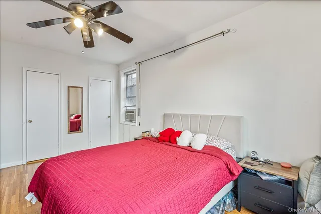 a bed room with a bed and a chandelier