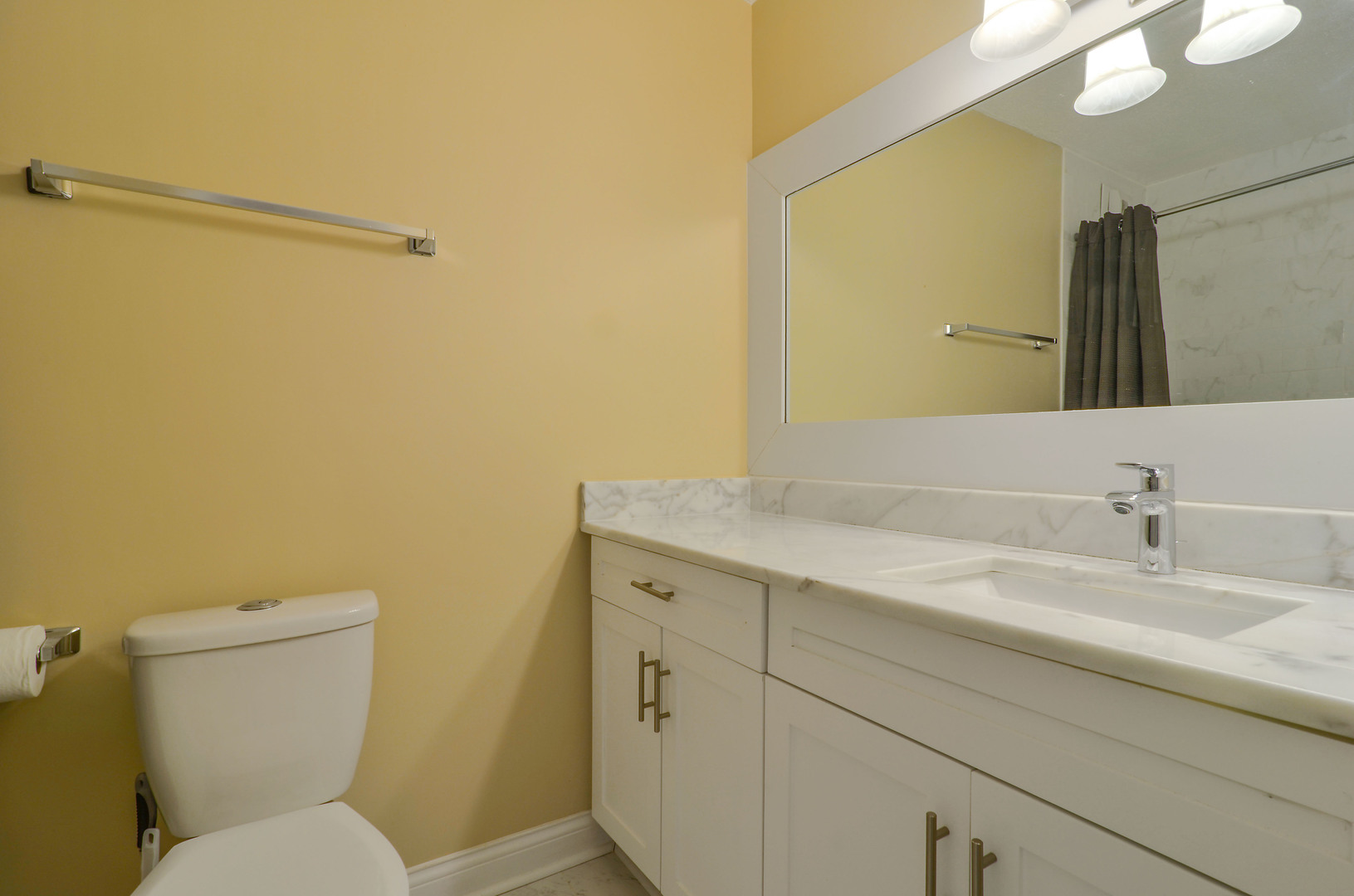 405 North Wabash Avenue, Unit 4512 Chicago, IL 60611 - Photo 6 of 20 a bathroom with a granite countertop toilet sink and mirror