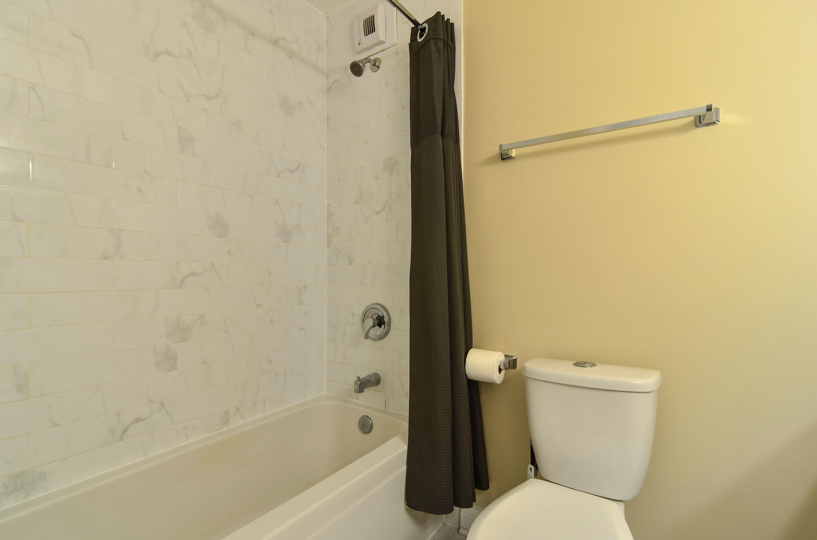 405 North Wabash Avenue, Unit 4512 Chicago, IL 60611 - Photo 7 of 20 a white toilet sitting next to a bath tub and a shower