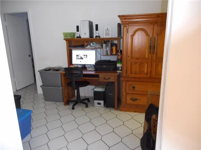 a workspace with furniture and window