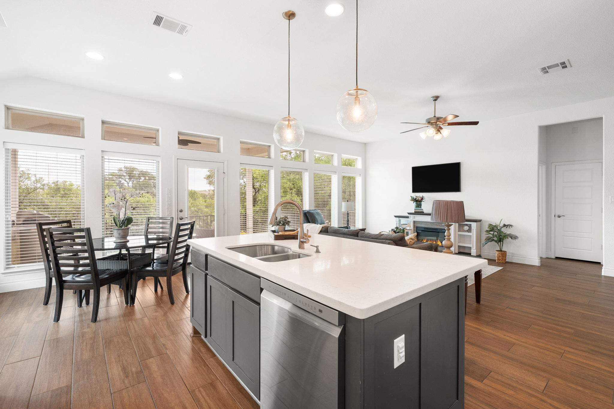 1908 Woolsey Way Leander, TX 78641 - Photo 5 of 36 Kitchen features an inviting island and abundant natural light from numerous windows.