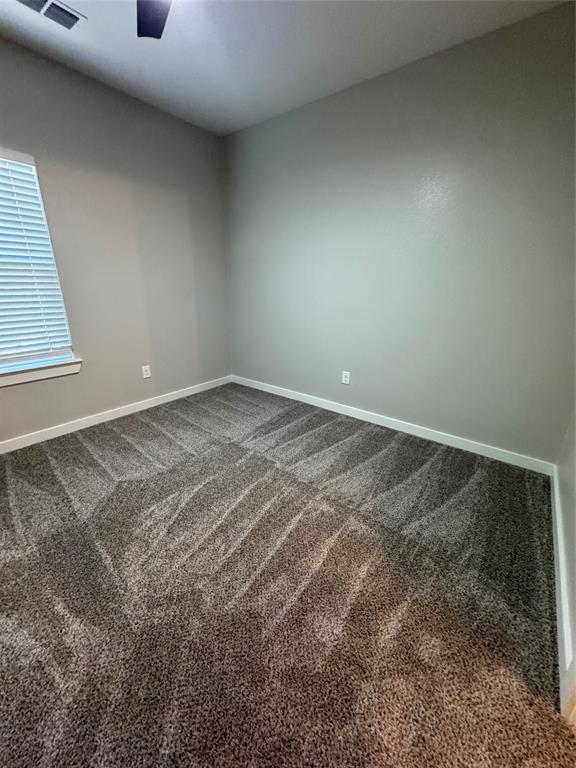 1505 Park Street, Unit A Commerce, TX 75428 - Photo 17 of 25 a view of an empty room and window