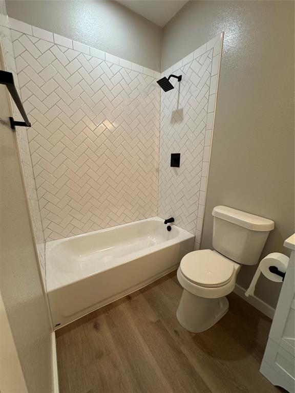 1505 Park Street, Unit A Commerce, TX 75428 - Photo 21 of 25 a bathroom with a toilet and a shower