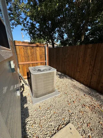 a wooden bench sitting in front of a house