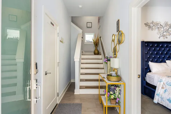 a view of entryway with furniture and wooden floor