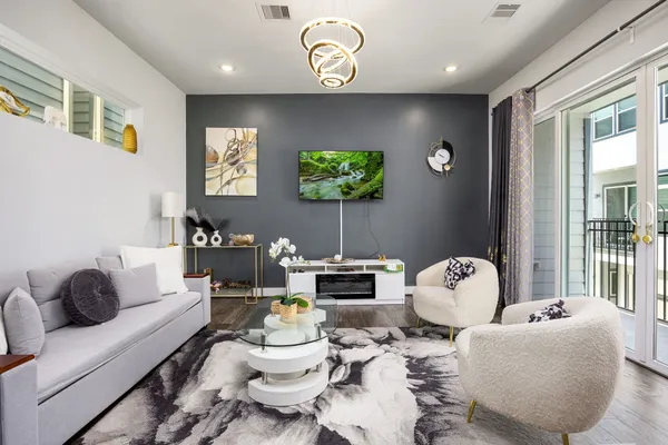 a living room with furniture and a flat screen tv