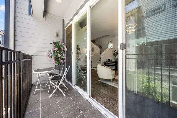 a bathroom with a glass door shower and a sink