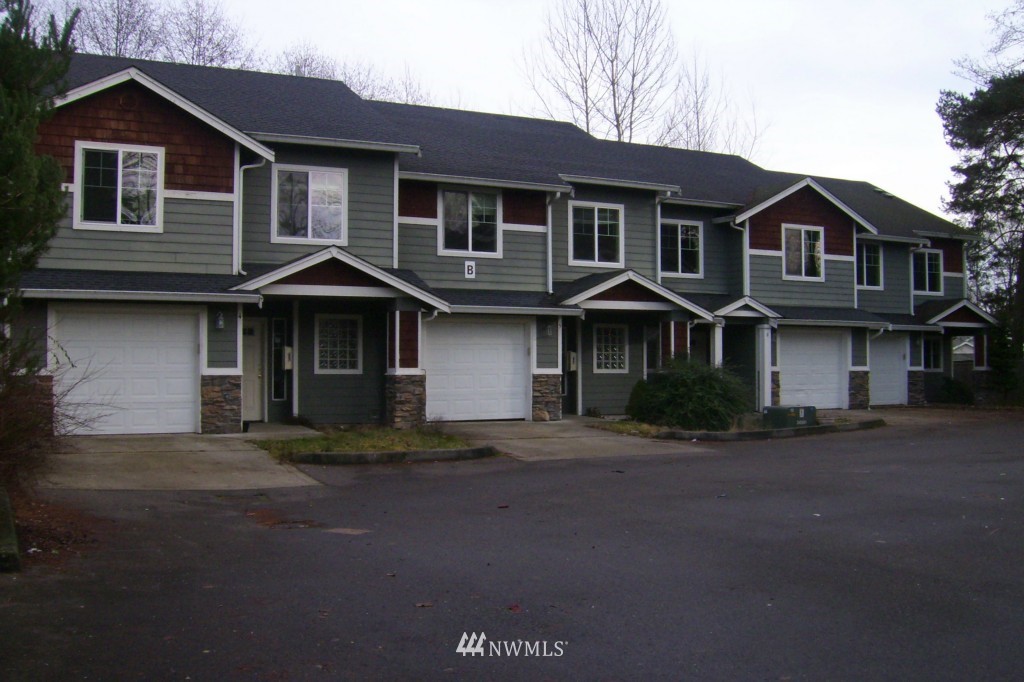 11911 East Gibson Road, Unit B Everett, WA 98204 - Photo 1 of 19 a front view of a house with a yard
