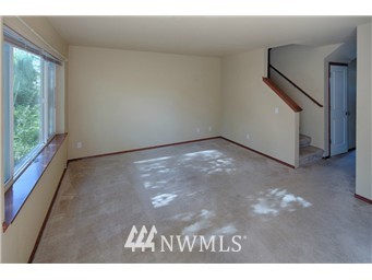 11911 East Gibson Road, Unit B Everett, WA 98204 - Photo 11 of 19 a view of a big room with wooden floor