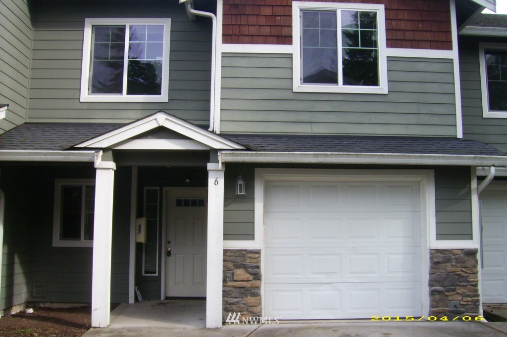 11911 East Gibson Road, Unit B Everett, WA 98204 - Photo 4 of 19 a front view of a house with garage