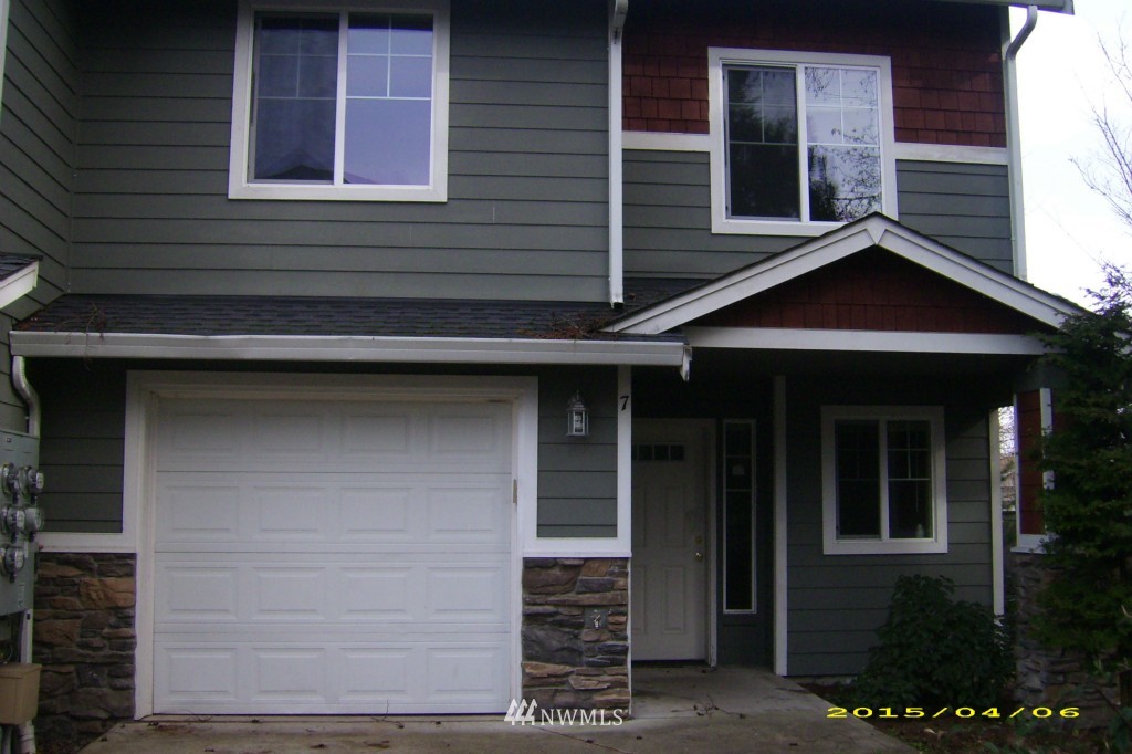 11911 East Gibson Road, Unit B Everett, WA 98204 - Photo 5 of 19 a front view of a house with a garage