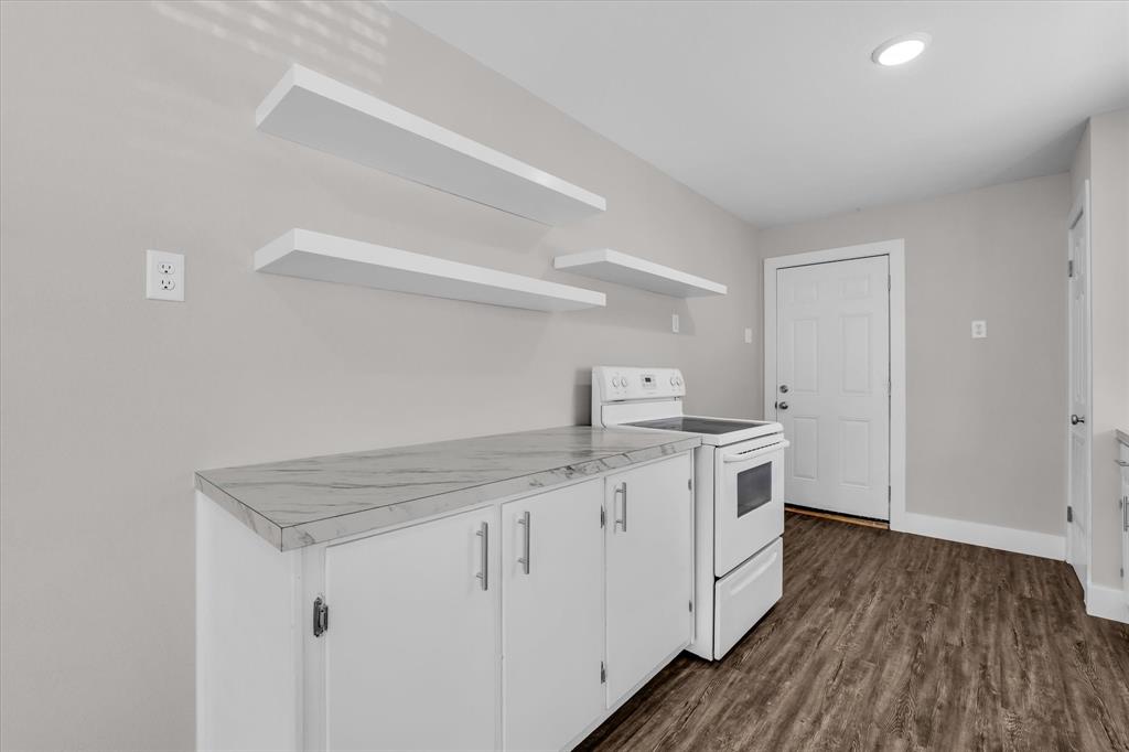 1908 South 19th Street Waco, TX 76706 - Photo 11 of 29 a utility room with cabinets washer and dryer