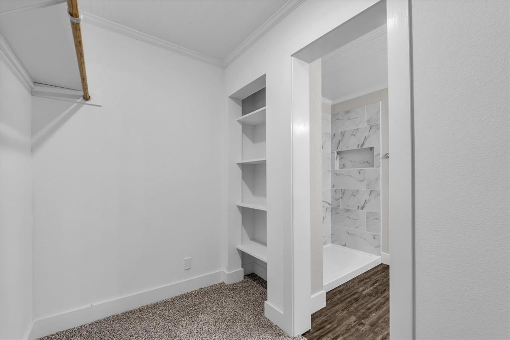 1908 South 19th Street Waco, TX 76706 - Photo 17 of 29 a bathroom with a bathtub and shower
