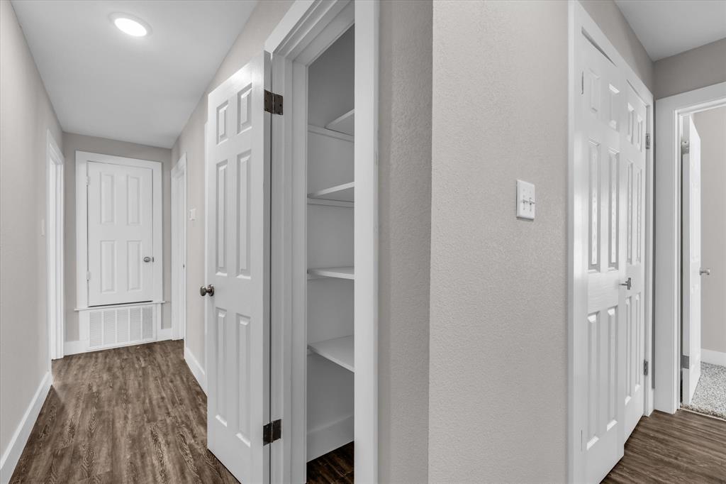 1908 South 19th Street Waco, TX 76706 - Photo 18 of 29 a view of a hallway with wooden floor and staircase