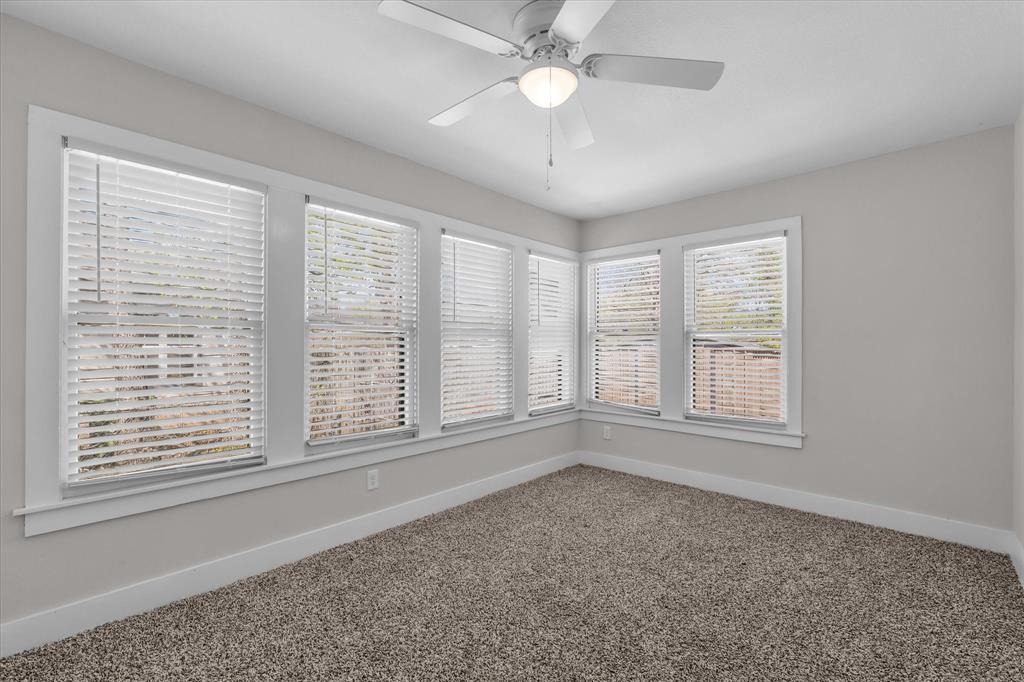1908 South 19th Street Waco, TX 76706 - Photo 22 of 29 wooden floor in an empty room with a window