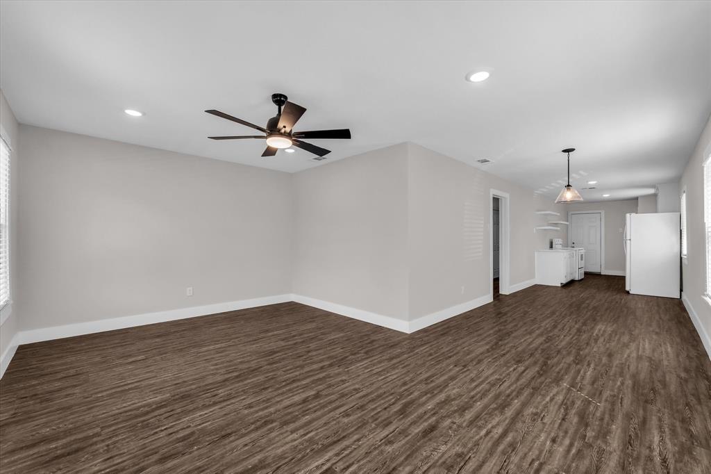 1908 South 19th Street Waco, TX 76706 - Photo 5 of 29 a view of a livingroom with a hardwood floor and a ceiling fan