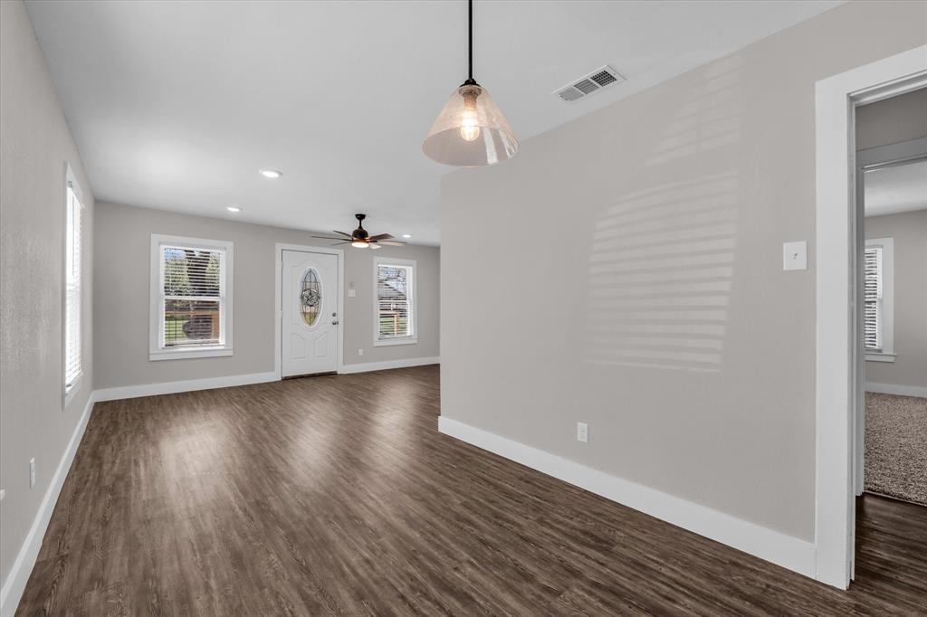 1908 South 19th Street Waco, TX 76706 - Photo 8 of 29 a view of a room with wooden floor and window