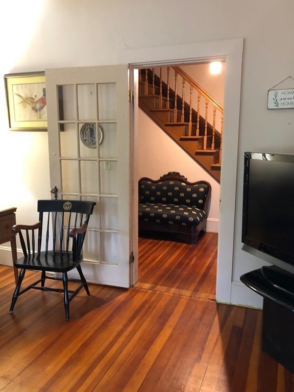 1054 County Road Bourne, MA 02534 - Photo 12 of 40 a view of a livingroom with furniture and staircase