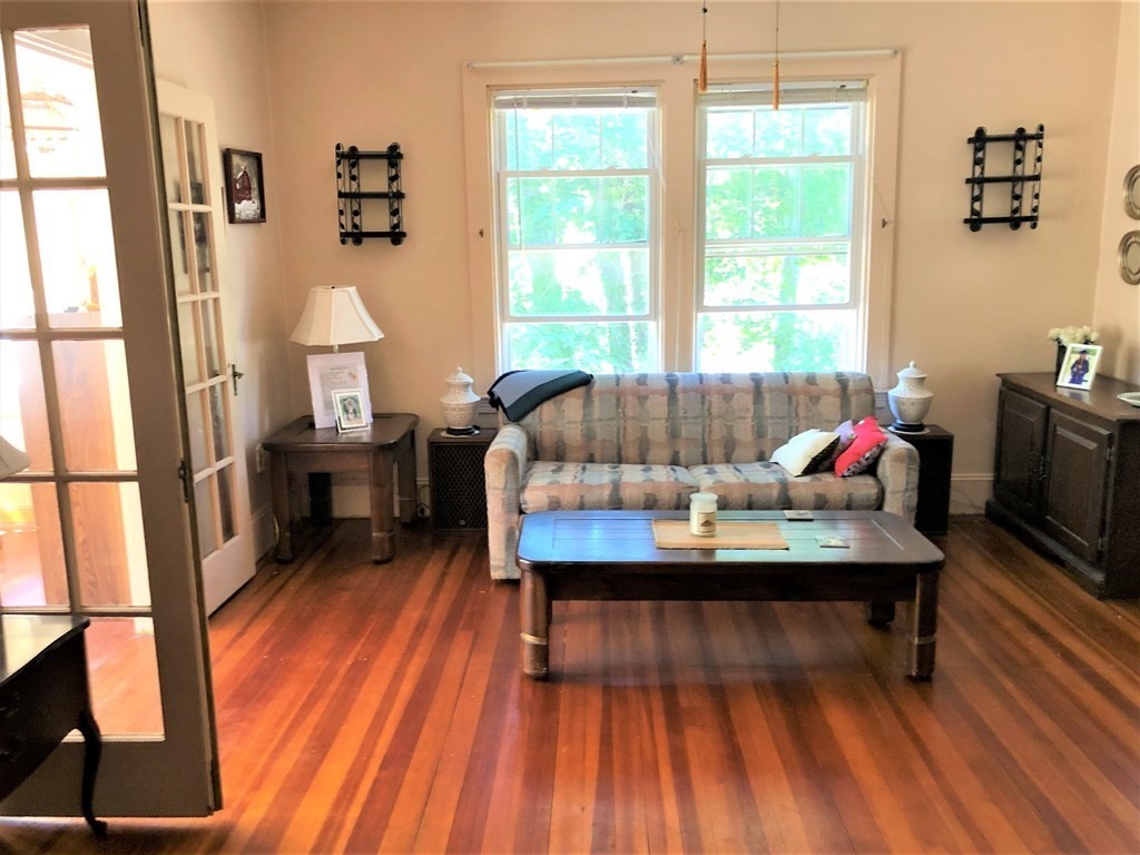 1054 County Road Bourne, MA 02534 - Photo 13 of 40 a living room with furniture and wooden floor