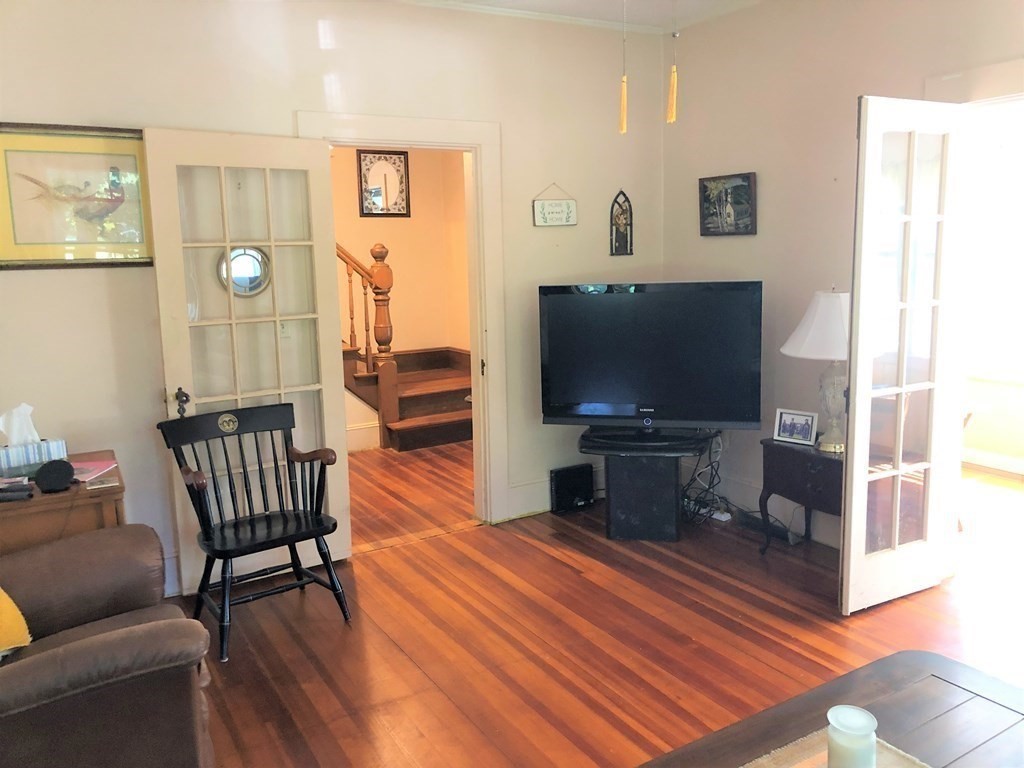 1054 County Road Bourne, MA 02534 - Photo 14 of 40 a living room with furniture and a flat screen tv