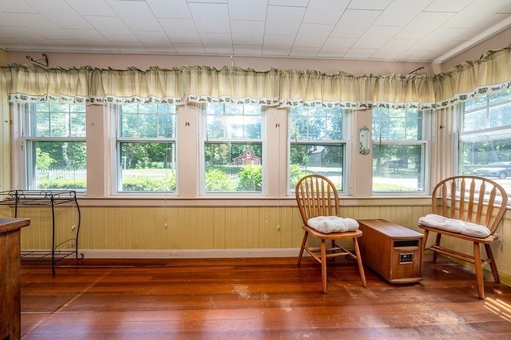 1054 County Road Bourne, MA 02534 - Photo 16 of 40 a living room filled with furniture and a large window