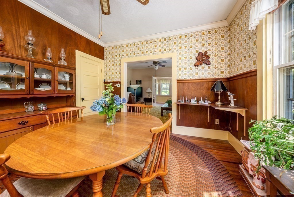 1054 County Road Bourne, MA 02534 - Photo 18 of 40 a dining room with furniture and wooden floor