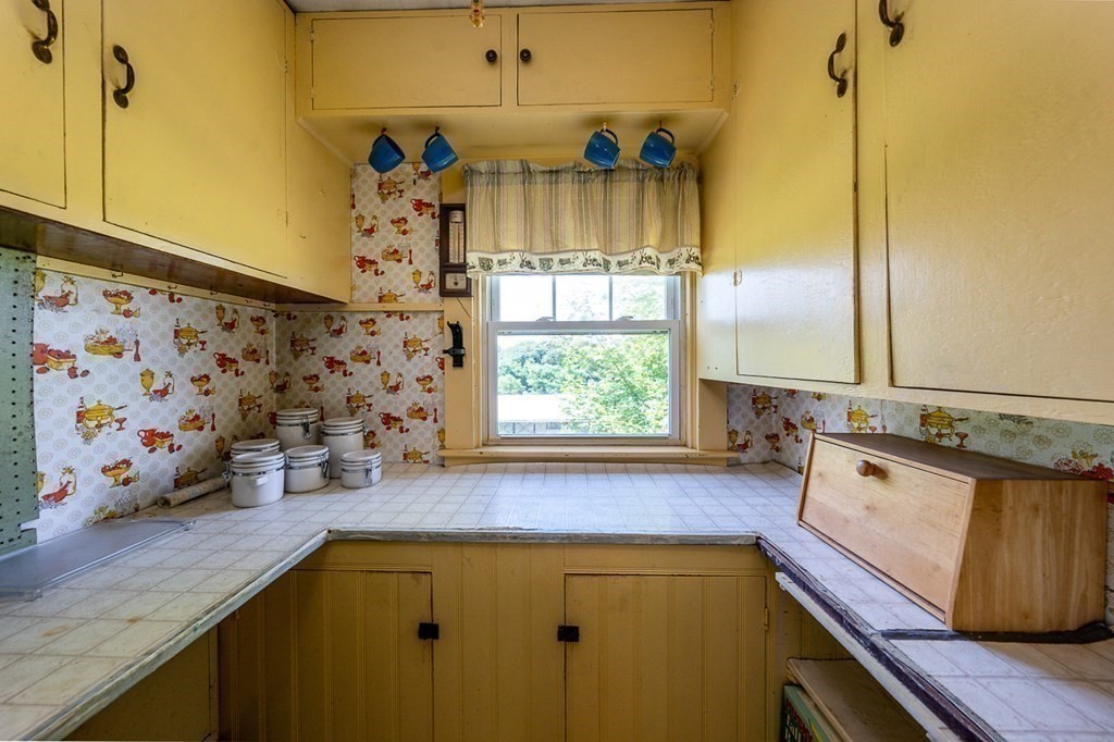 1054 County Road Bourne, MA 02534 - Photo 22 of 40 a view of a kitchen with a sink and wooden floor
