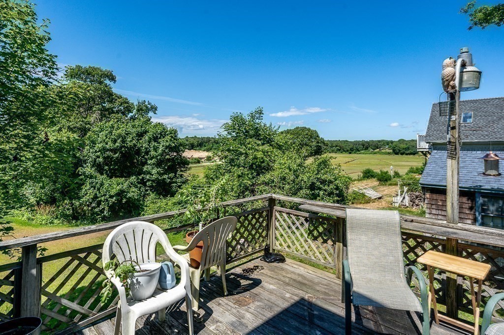 1054 County Road Bourne, MA 02534 - Photo 23 of 40 a view of a chairs and table on the balcony