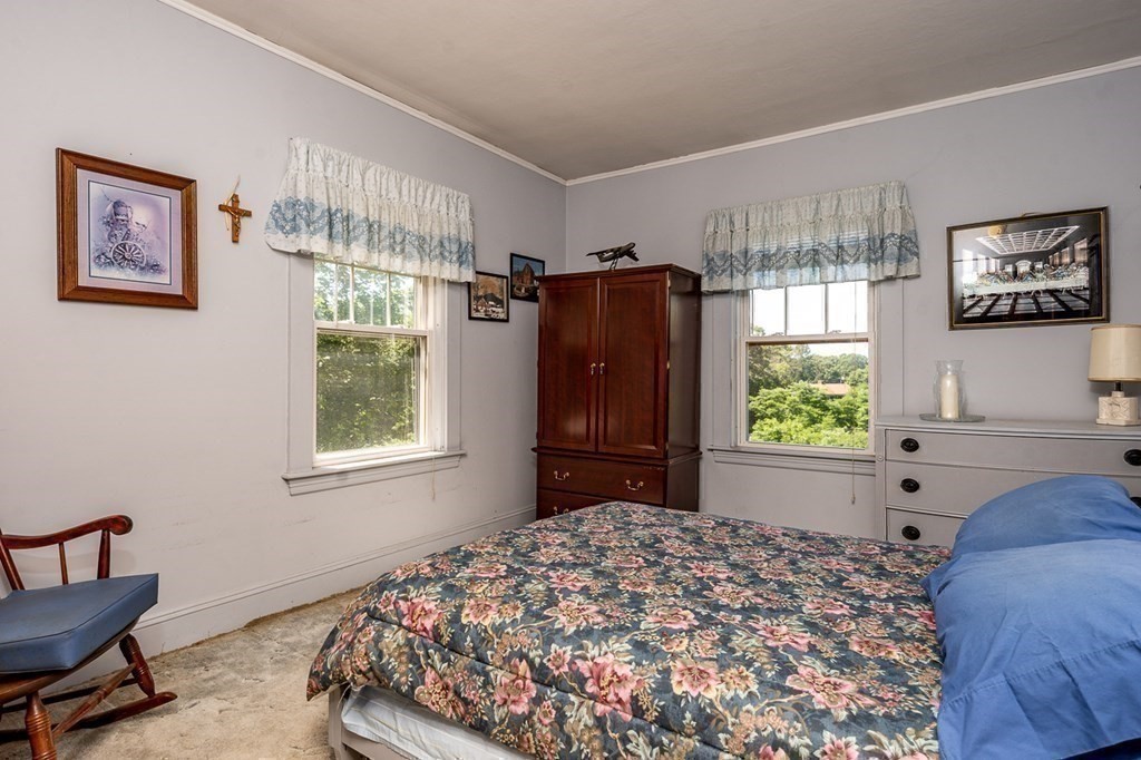1054 County Road Bourne, MA 02534 - Photo 25 of 40 a bedroom with a bed and a window