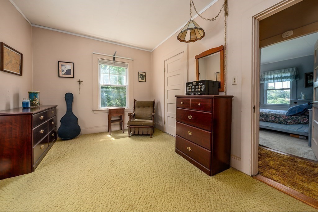 1054 County Road Bourne, MA 02534 - Photo 27 of 40 a bedroom with furniture and a window