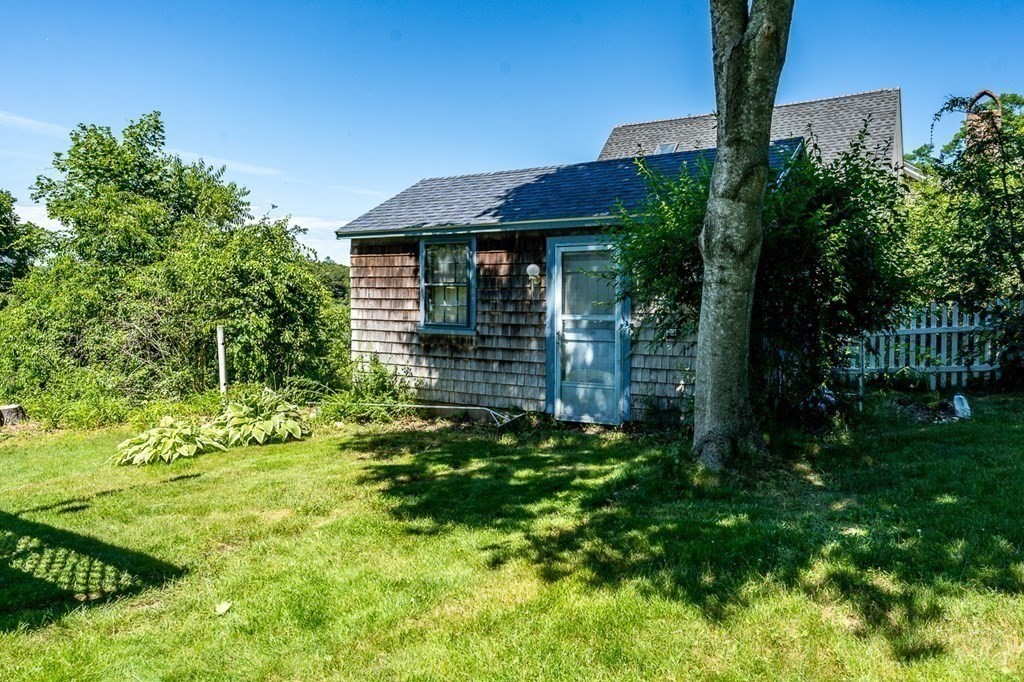1054 County Road Bourne, MA 02534 - Photo 4 of 40 a view of a house with a yard