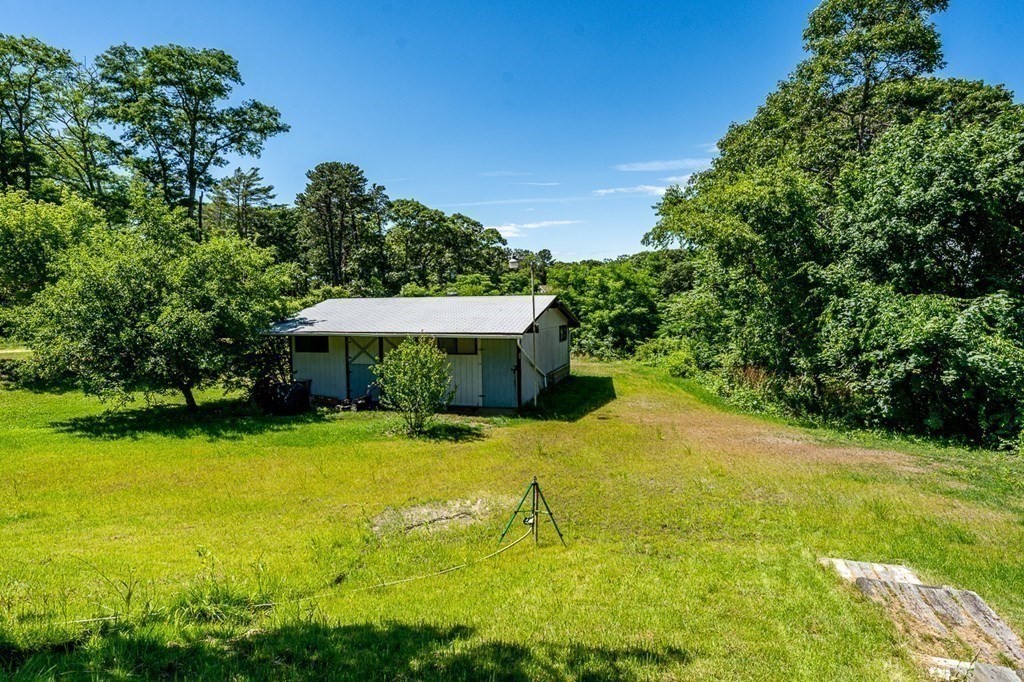 1054 County Road Bourne, MA 02534 - Photo 5 of 40 a view of a house with pool and a yard