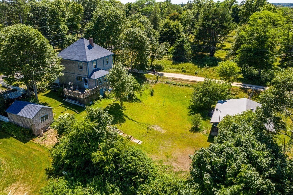 1054 County Road Bourne, MA 02534 - Photo 6 of 40 a aerial view of a house with swimming pool and garden