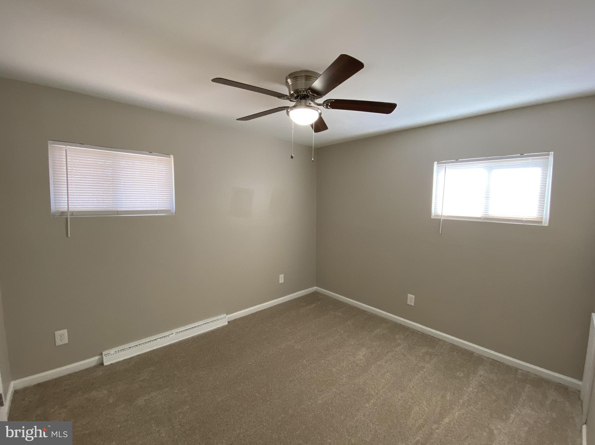 82 West Stephen Drive Newark, DE 19713 - Photo 15 of 17 an empty room with a window and a fan