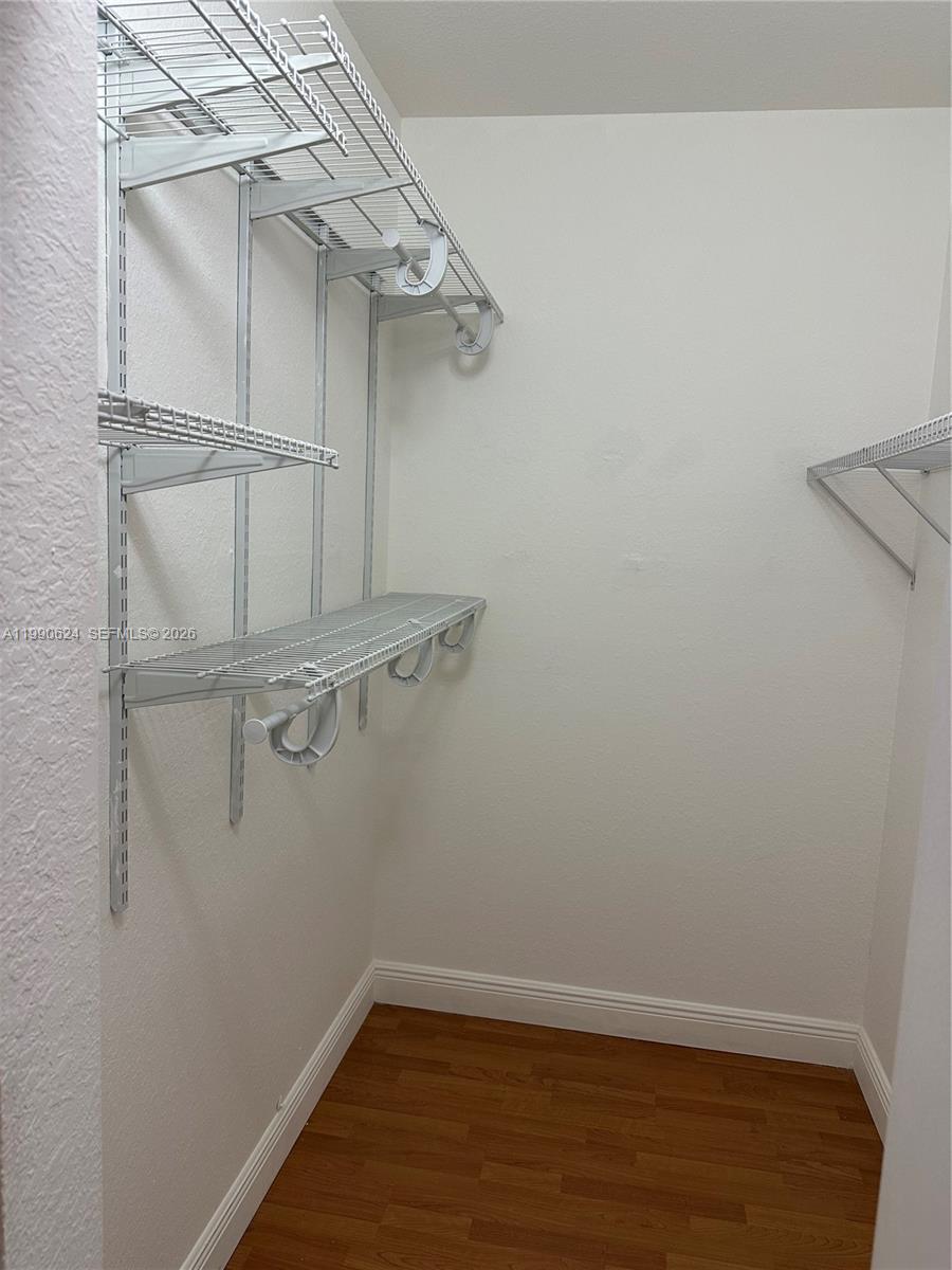 7549 Northwest 175th Street, Unit 7549 Hialeah, FL 33015 - Photo 18 of 34 a view of a room with racks on the wall