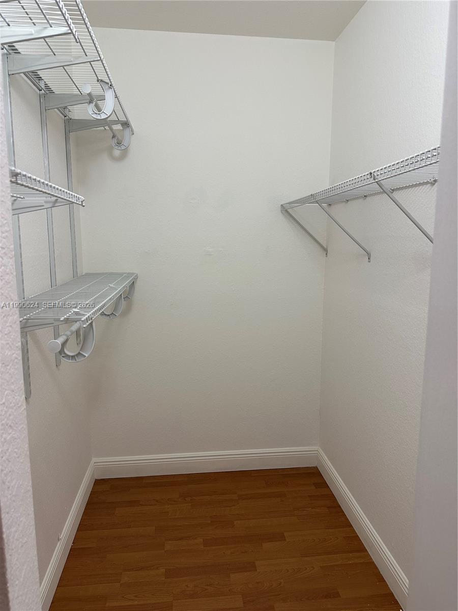 7549 Northwest 175th Street, Unit 7549 Hialeah, FL 33015 - Photo 19 of 34 a view of a room with racks on the wall