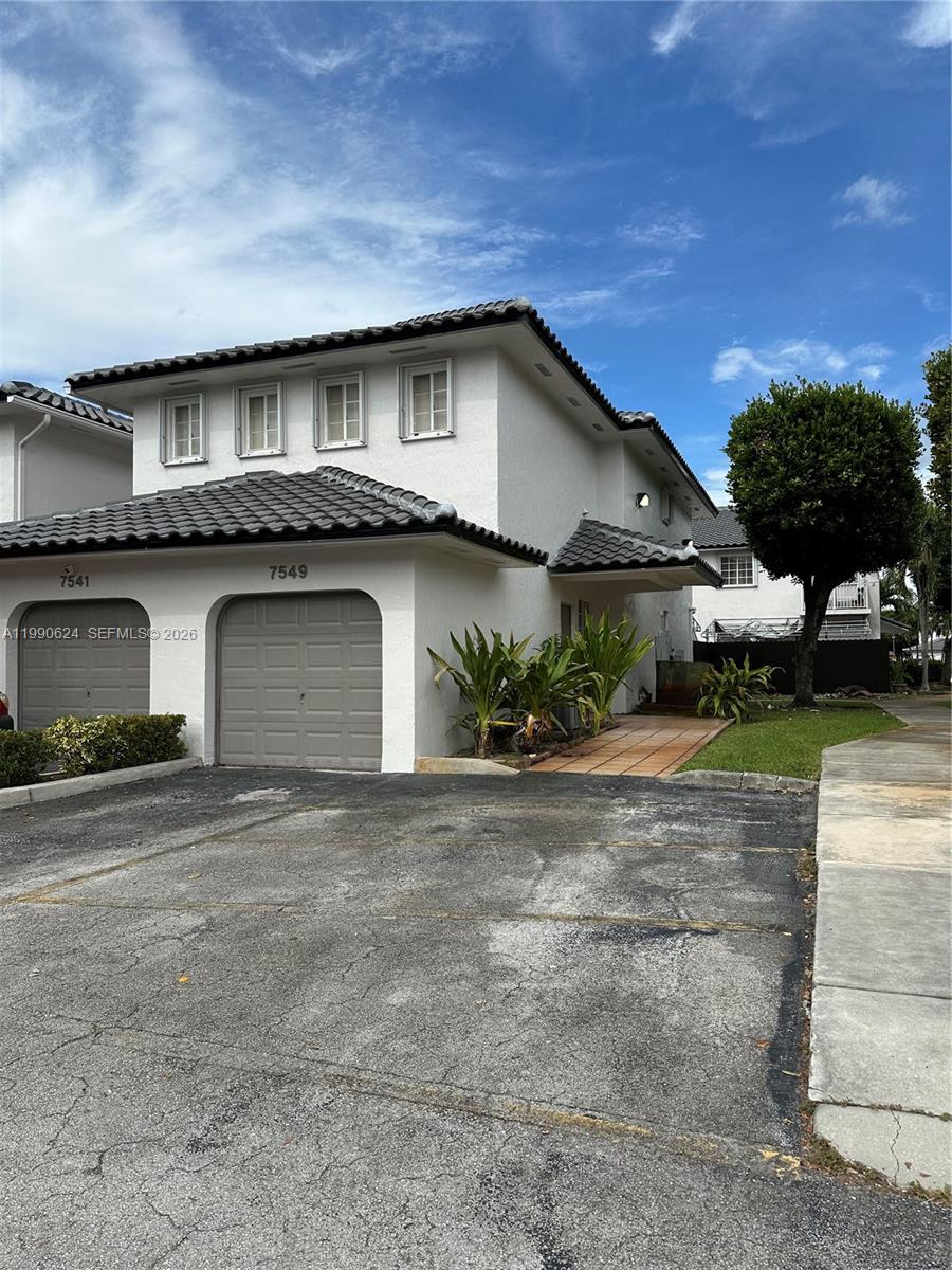 7549 Northwest 175th Street, Unit 7549 Hialeah, FL 33015 - Photo 2 of 34 a house with a outdoor space