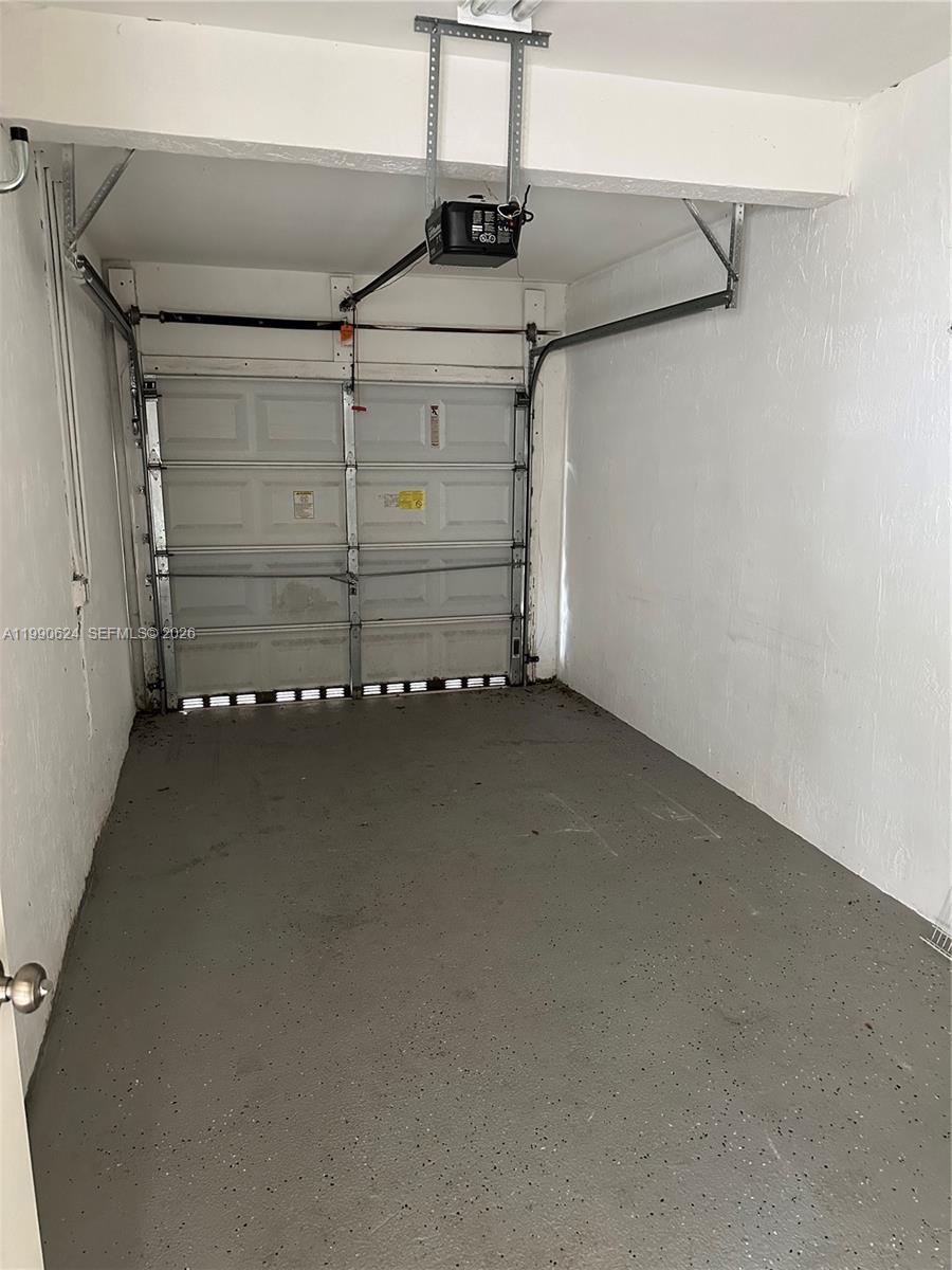 7549 Northwest 175th Street, Unit 7549 Hialeah, FL 33015 - Photo 6 of 34 a view of a garage
