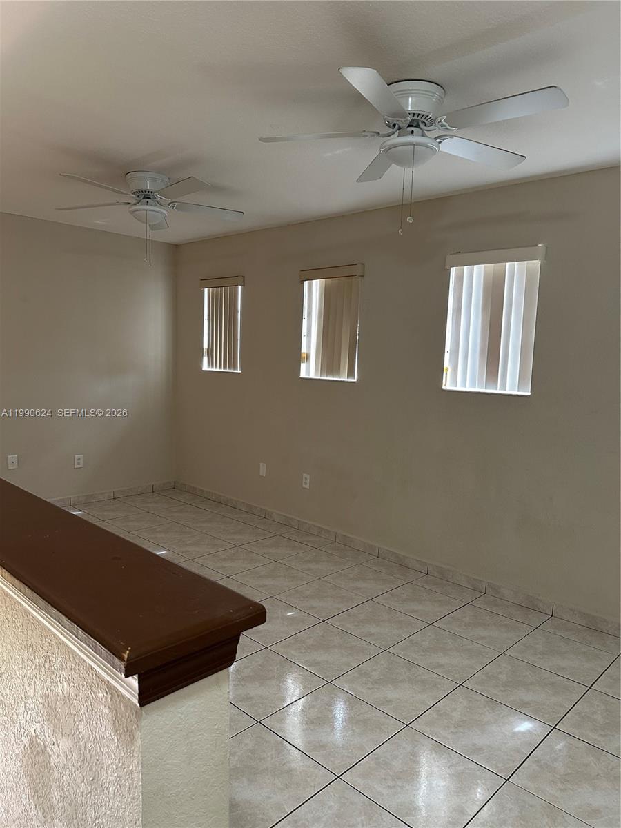 7549 Northwest 175th Street, Unit 7549 Hialeah, FL 33015 - Photo 10 of 34 a view of an empty room