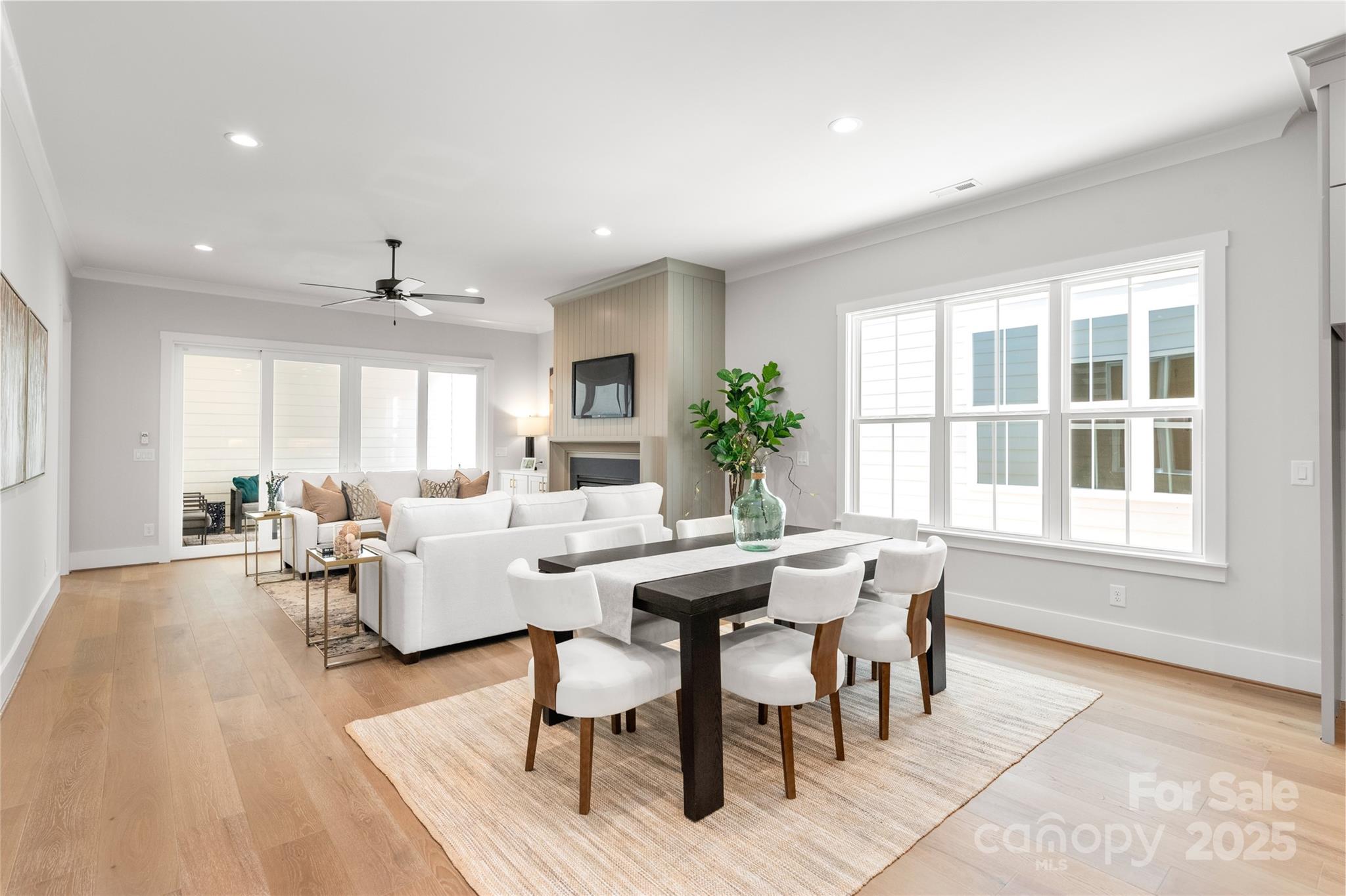 19028 Newburg Hill Road, Unit 22 Davidson, NC 28036 - Photo 14 of 44 a view of a dining room with furniture window and wooden floor