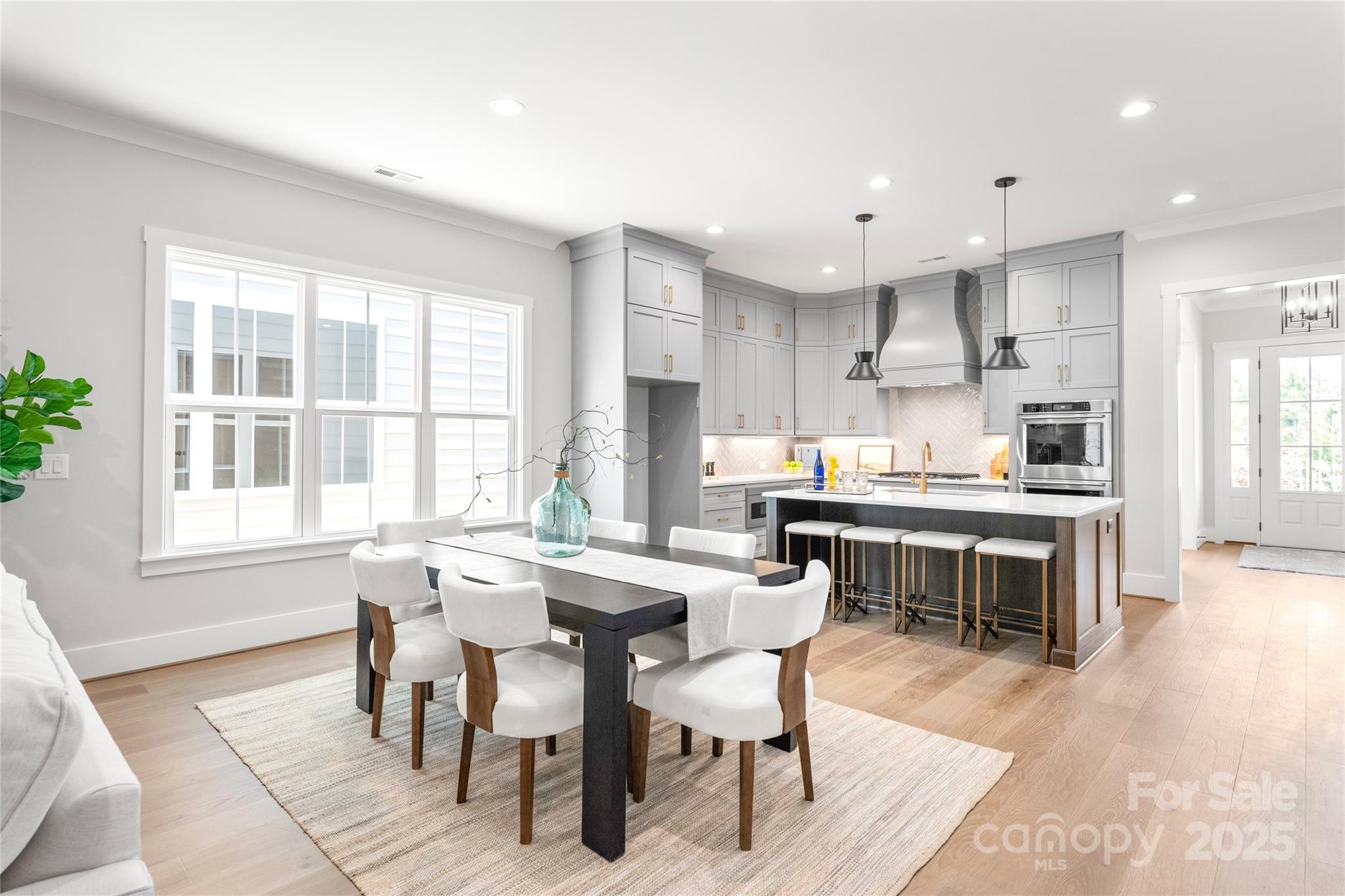 19028 Newburg Hill Road, Unit 22 Davidson, NC 28036 - Photo 15 of 44 a view of a dining room with furniture and wooden floor