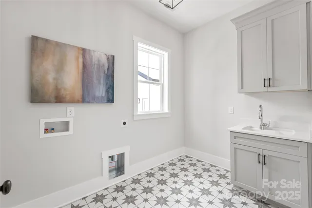 a room with a sink and a mirror