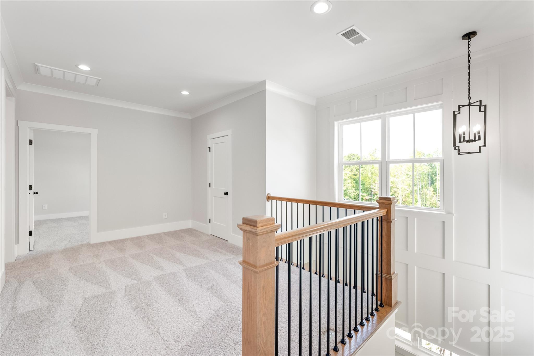 19028 Newburg Hill Road, Unit 22 Davidson, NC 28036 - Photo 29 of 44 a view of entryway with wooden floor