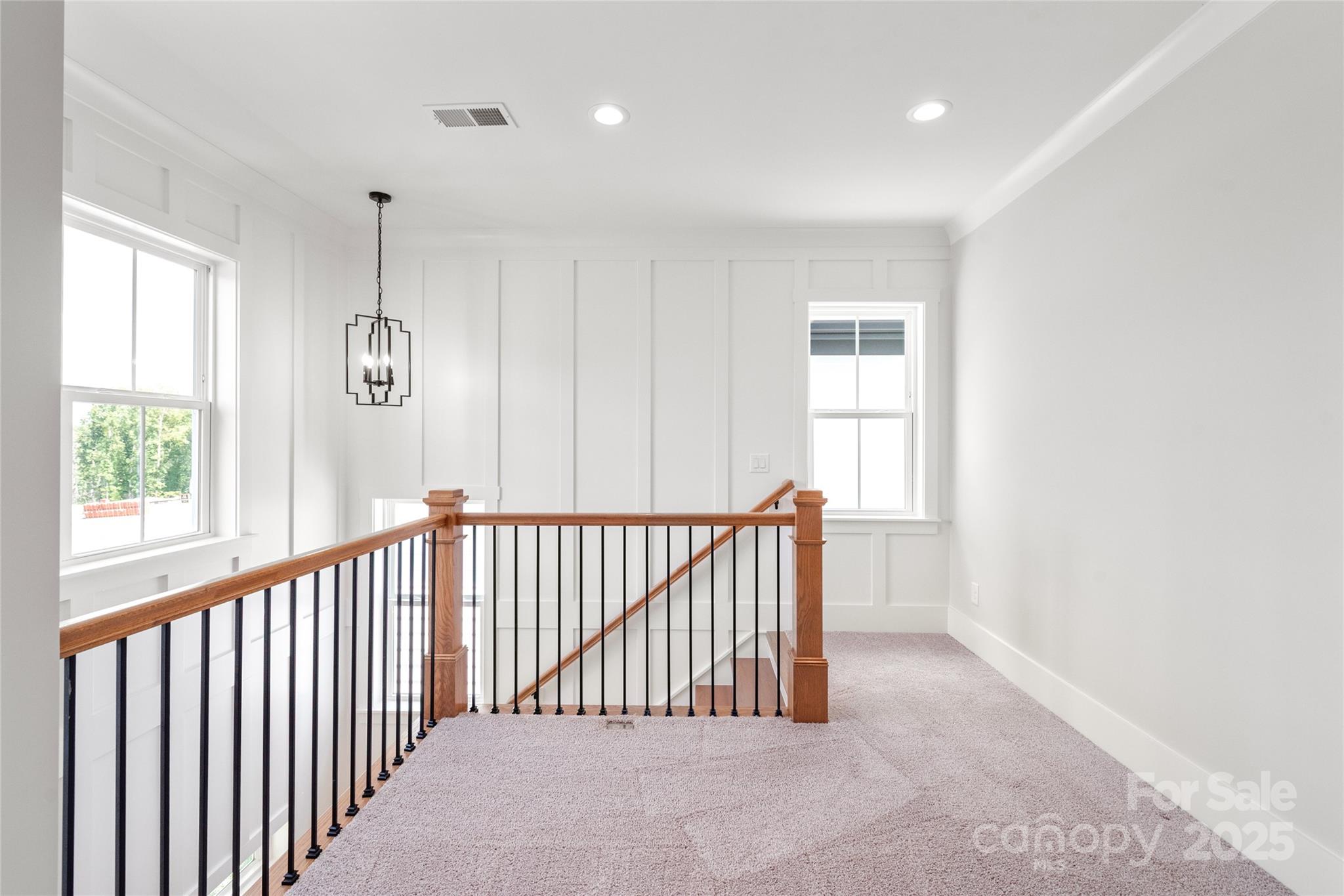 19028 Newburg Hill Road, Unit 22 Davidson, NC 28036 - Photo 30 of 44 a view of a hallway with windows