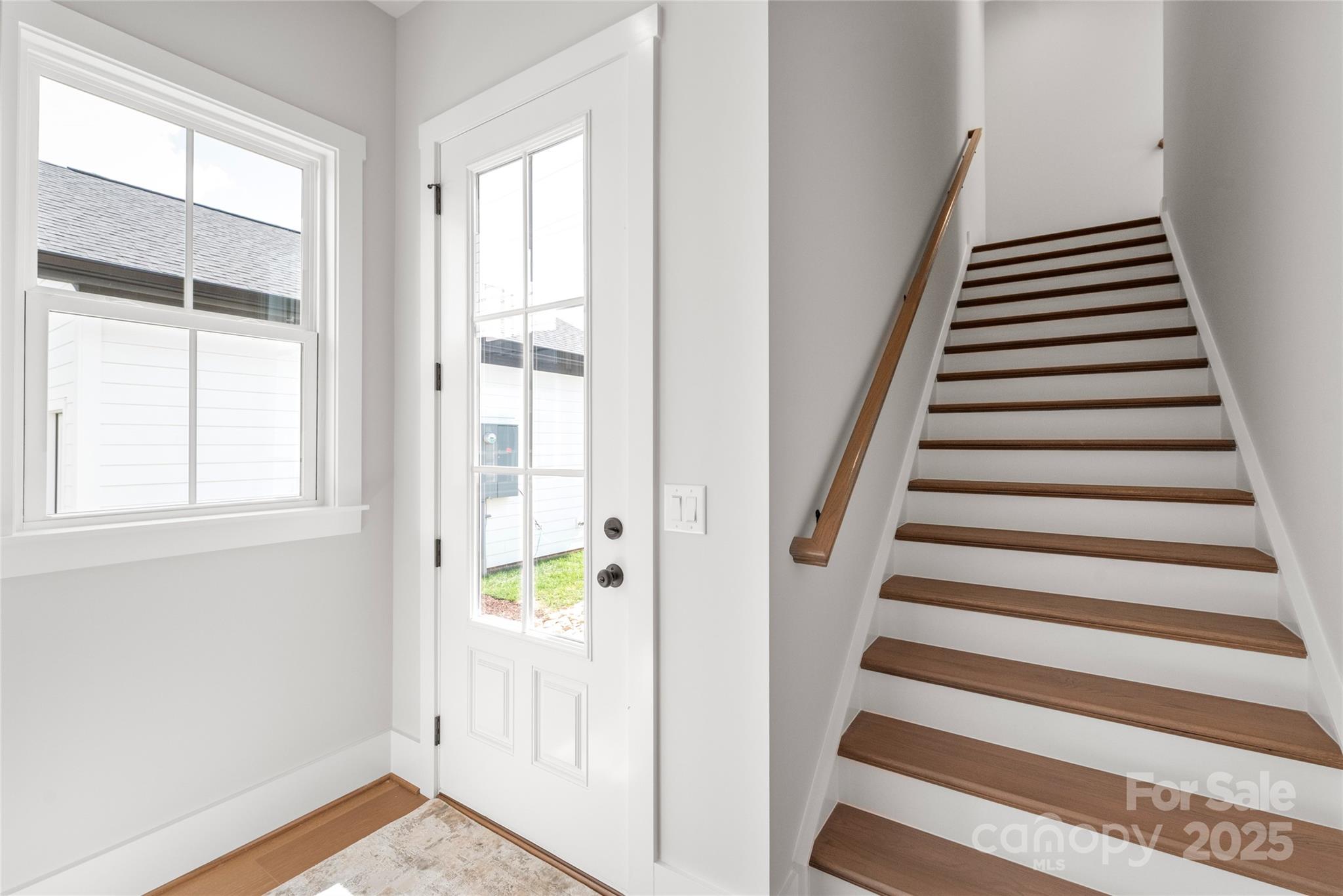 19028 Newburg Hill Road, Unit 22 Davidson, NC 28036 - Photo 37 of 44 a view of an entryway with staircase